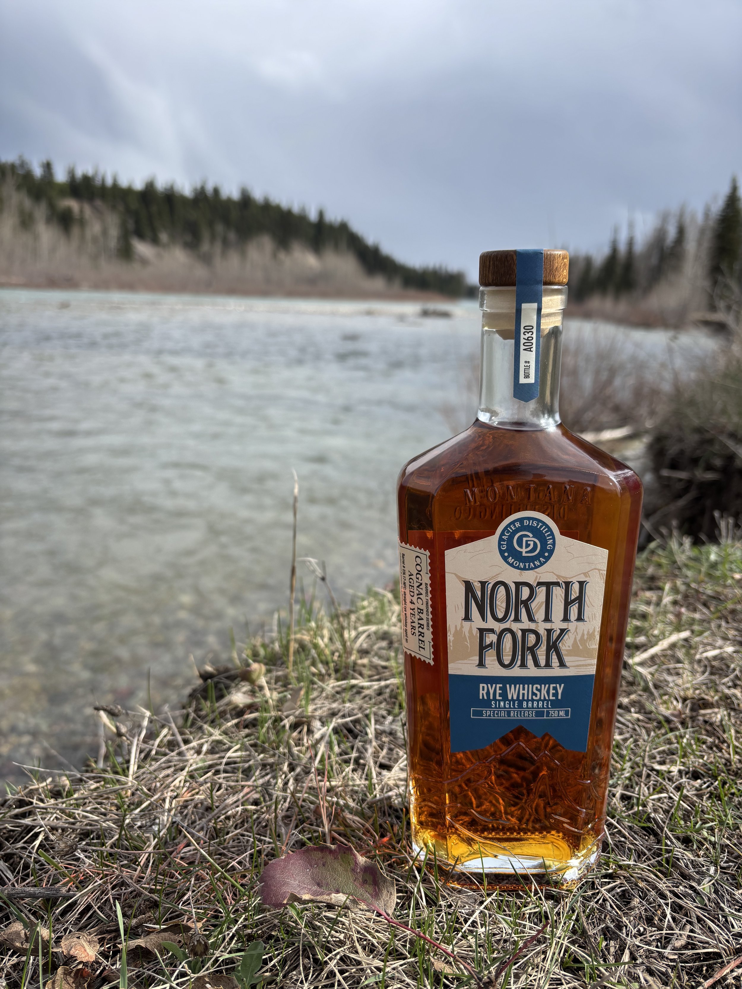 north fork rye whiskey bottle with river in background