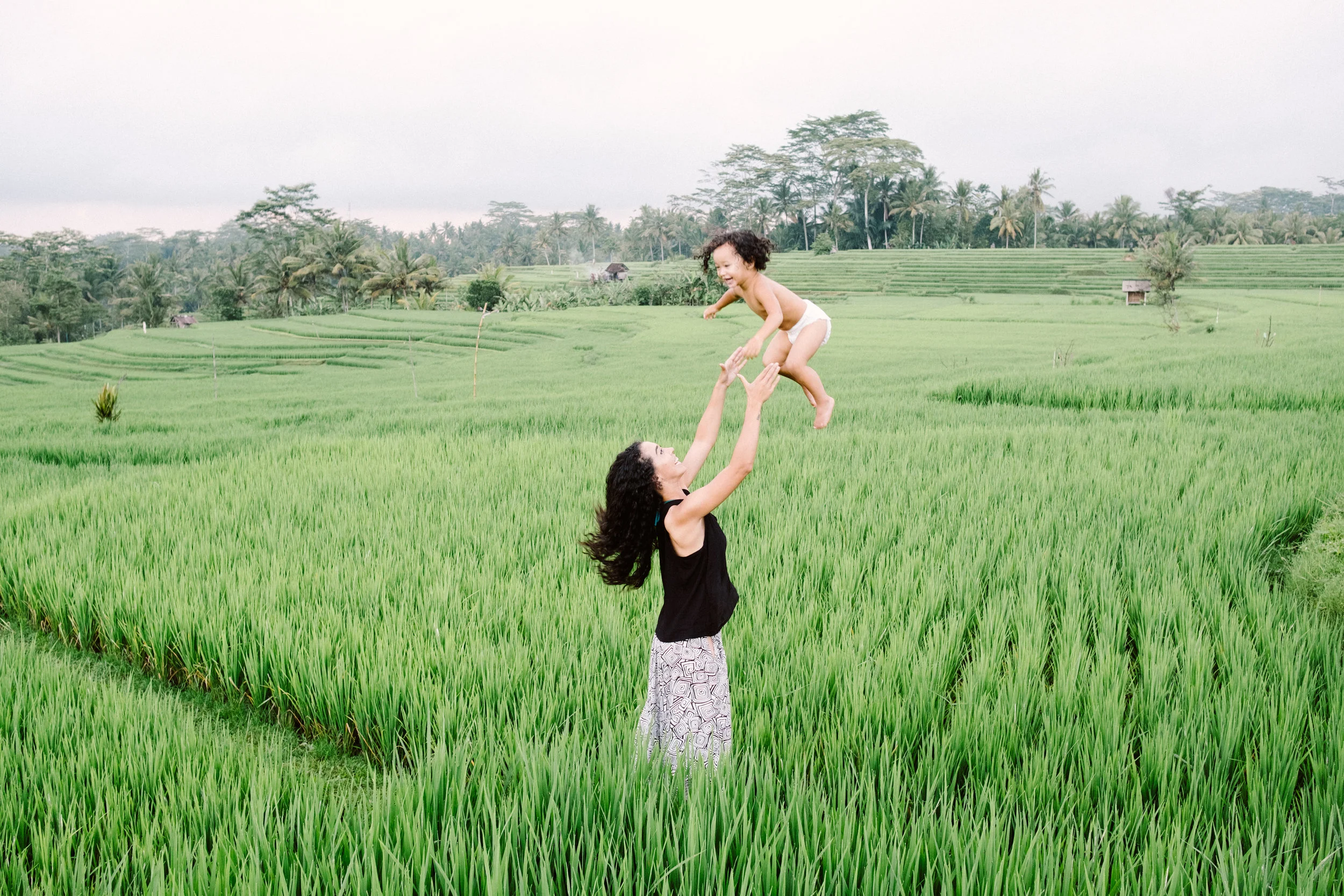 That's me. Throwing my toddler into the air. In a rice patty field. Which has nothing to do this with anything.
