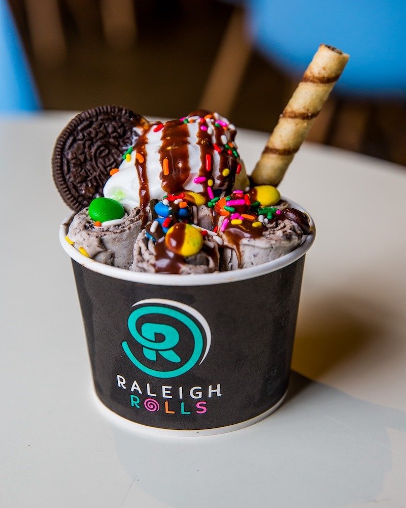 Craving chocolate? Try our Chocolate Overload roll featuring Oreos, M&amp;M's, and a Nutella drizzle wrapped up with a dark chocolate Pirouette. It's a chocoholic's dream! 🍫🌀 #ChocolateLover #RaleighEats