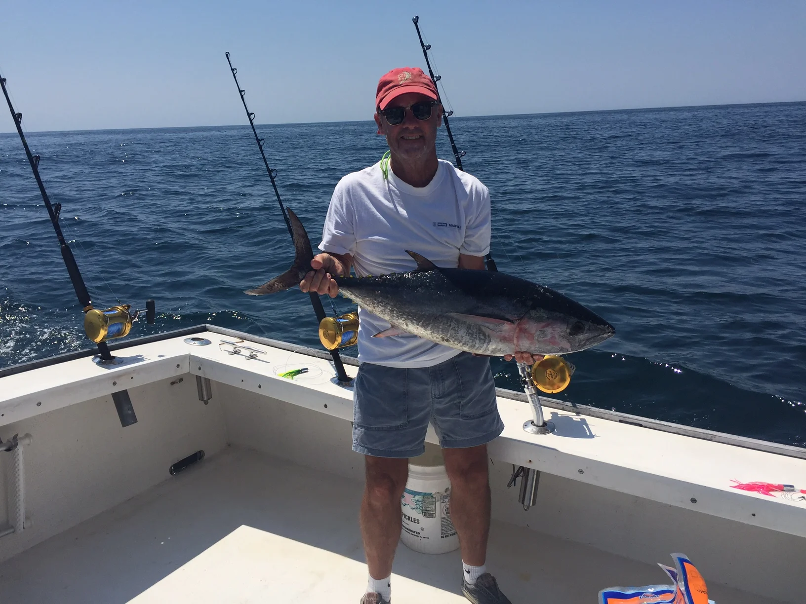 Jeff and tuna he caught.JPG