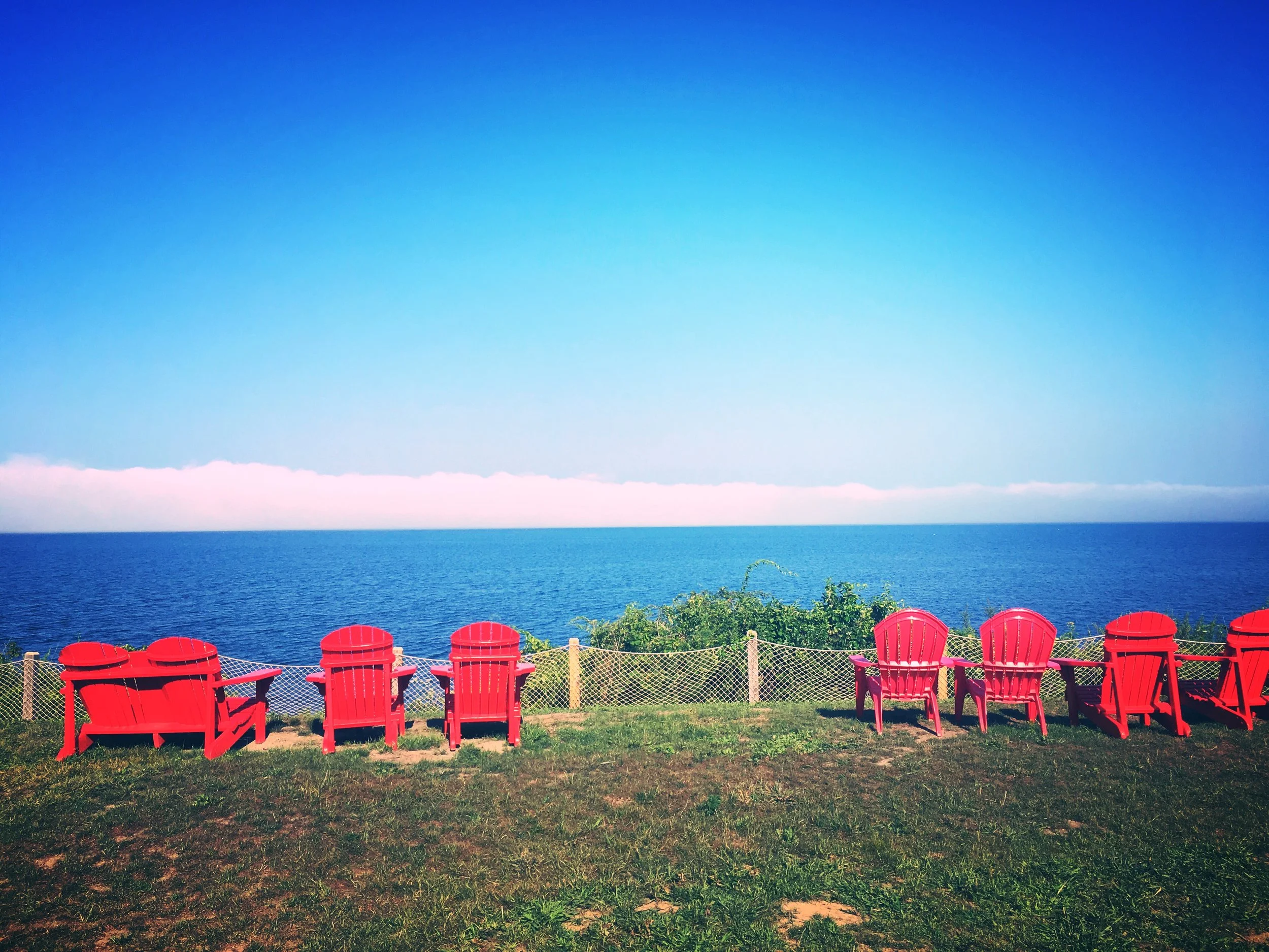Chairs at the end of the ride overlooking Naraganset Bay.