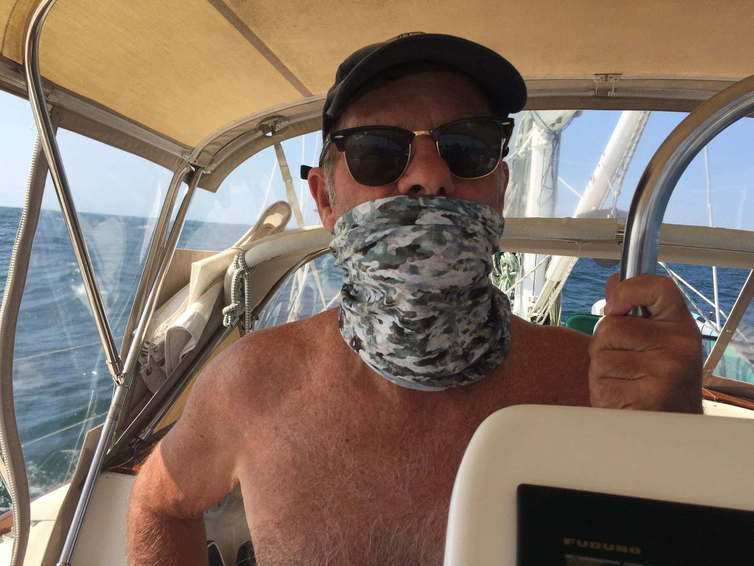  Jeff attempts to keep the sun off of his lips. 