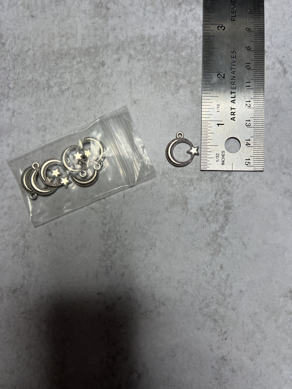 Silver-plated crescent moon charms (7)