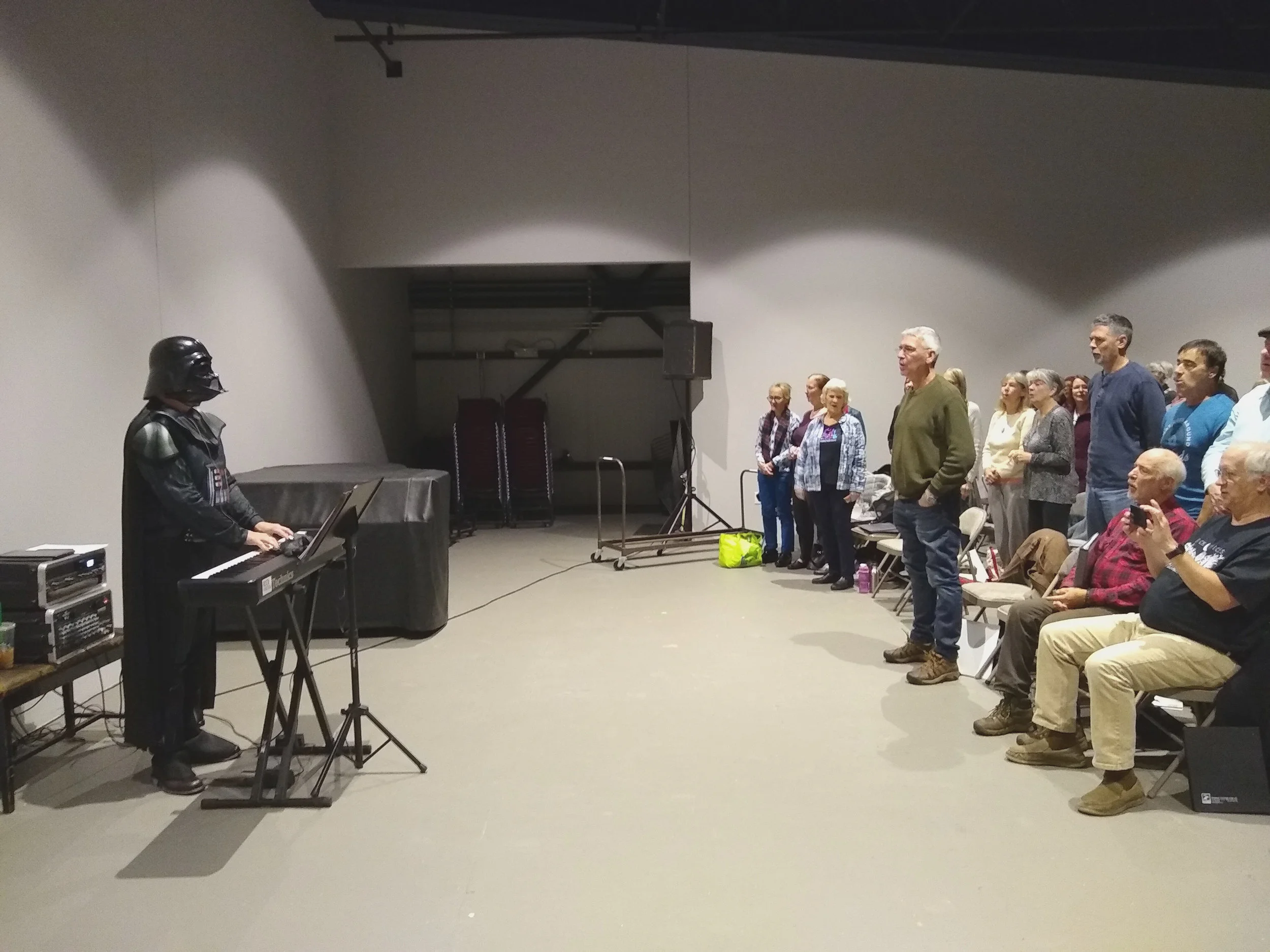 Tony Lechner as Darth Vader conducts a rehearsal of Rock Voices at its weekly rehearsal in the Flex. Tony is the founder and creative director of Rock Voices , Inc.
