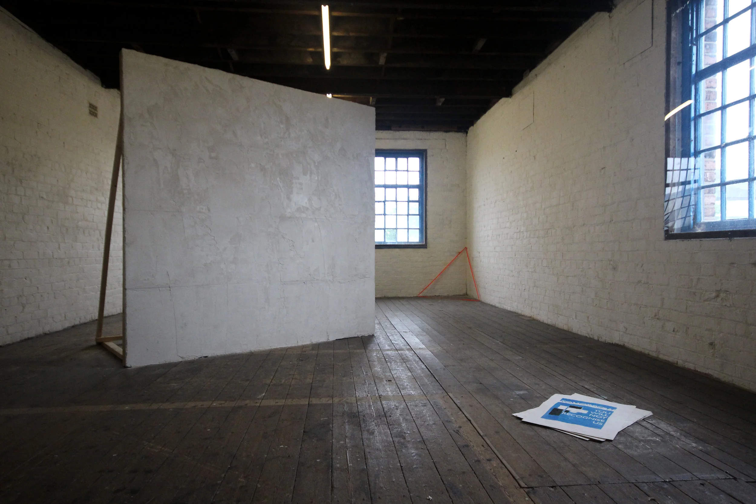 Concrete, polystyrene, wood, fabric tape, screen print on newsprint. Dimensions variable. 2016. Produced in collaboration with Oliver Perry and Kitty McMurray .