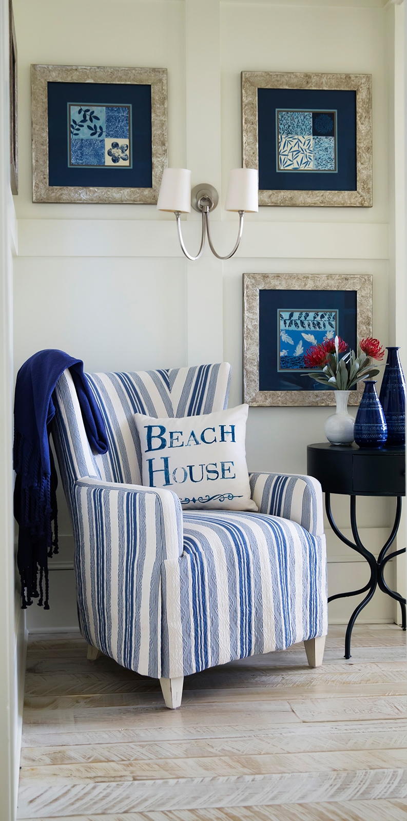 At The Beach: Inviting entry to guest bedroom Resources: Chair: Century Furniture Fabric: CR LainePattern: Marley Indigo Throw: Pottery Barn Side Table: Pottery Barn Wall Sconce: Visual Comfort Vases: Ethan Allen Art Prints: Art.com; Framing: Michaels Design Thought: It is convenient to have a chair or bench to sit on in the bedroom. A chair provides a place to rest at the beginning or end of the day. Adding a small table and reading light offers a cozy spot to unwind or just take it easy for a few minutes.