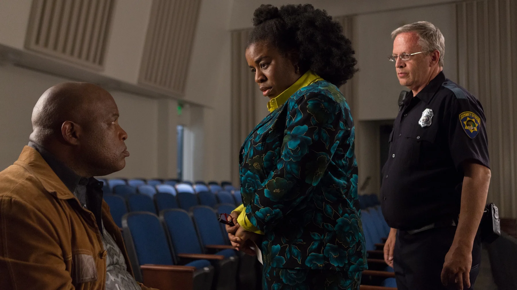 Virginia (Uzo Aduba) commiserates with a fellow concerned parent at a town hall meeting.