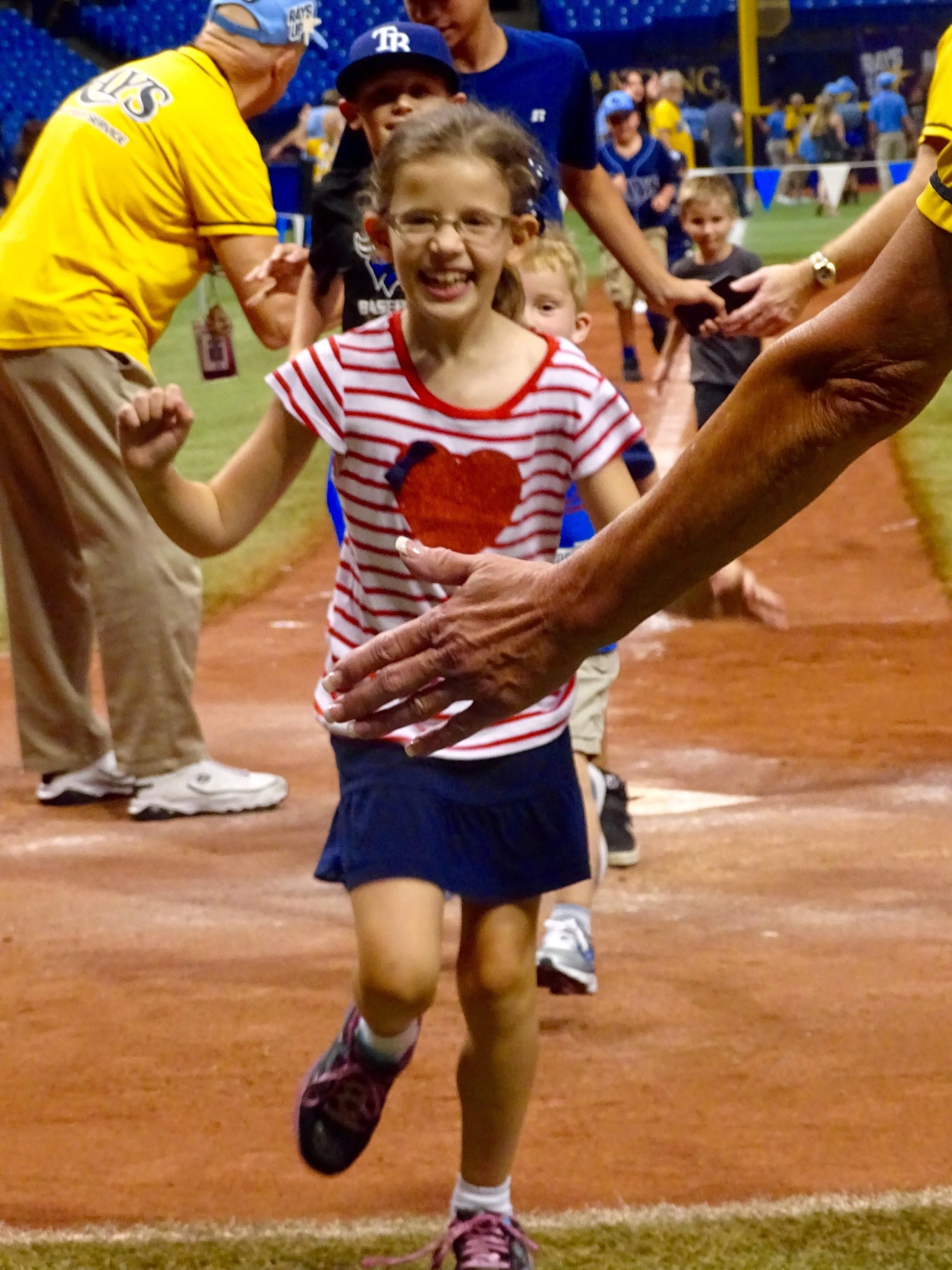 Our daughter running to home plate at Marlins Park in Miami, Florida.