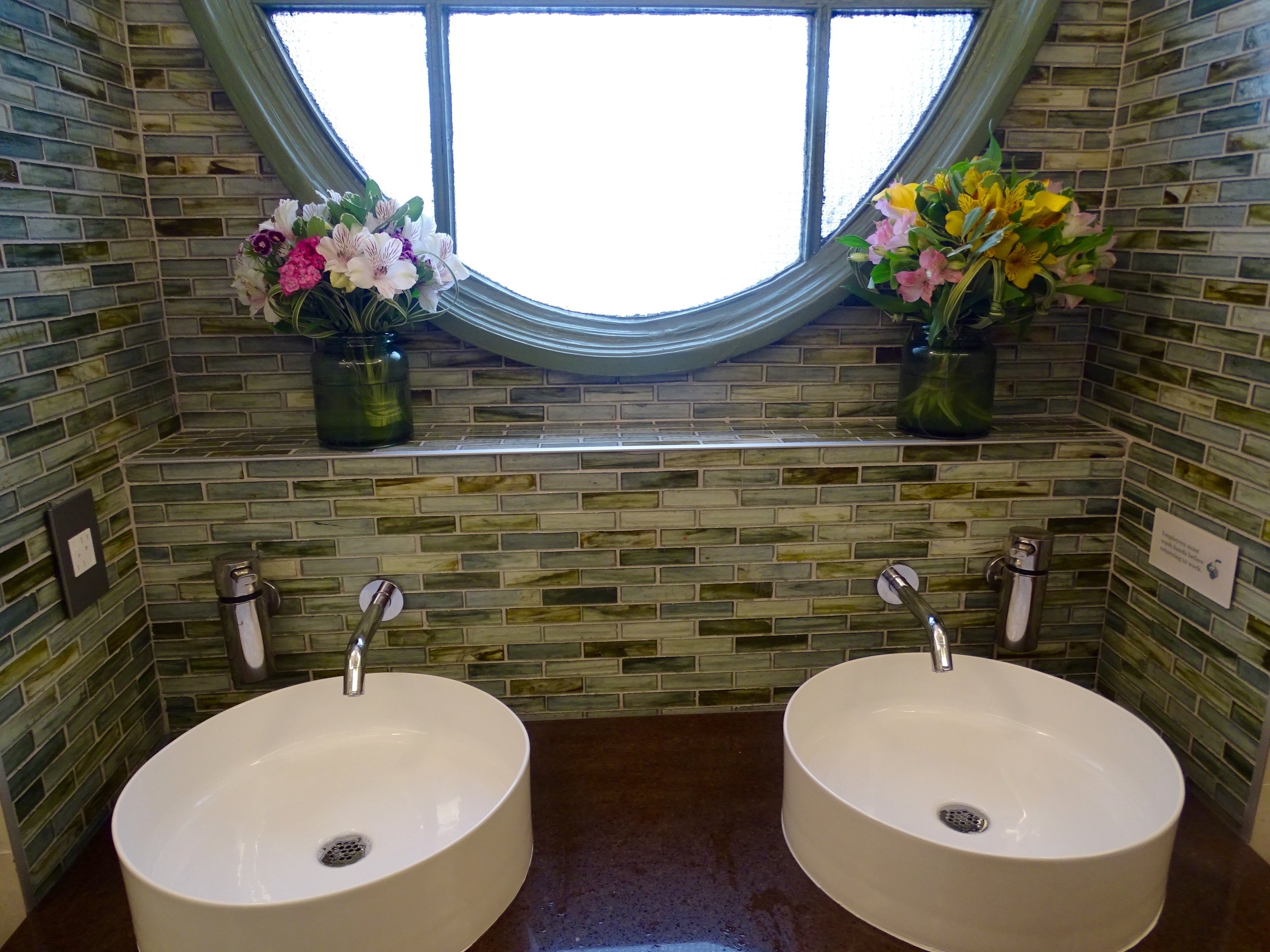 The women's bathroom; fresh flowers are delivered every Monday.