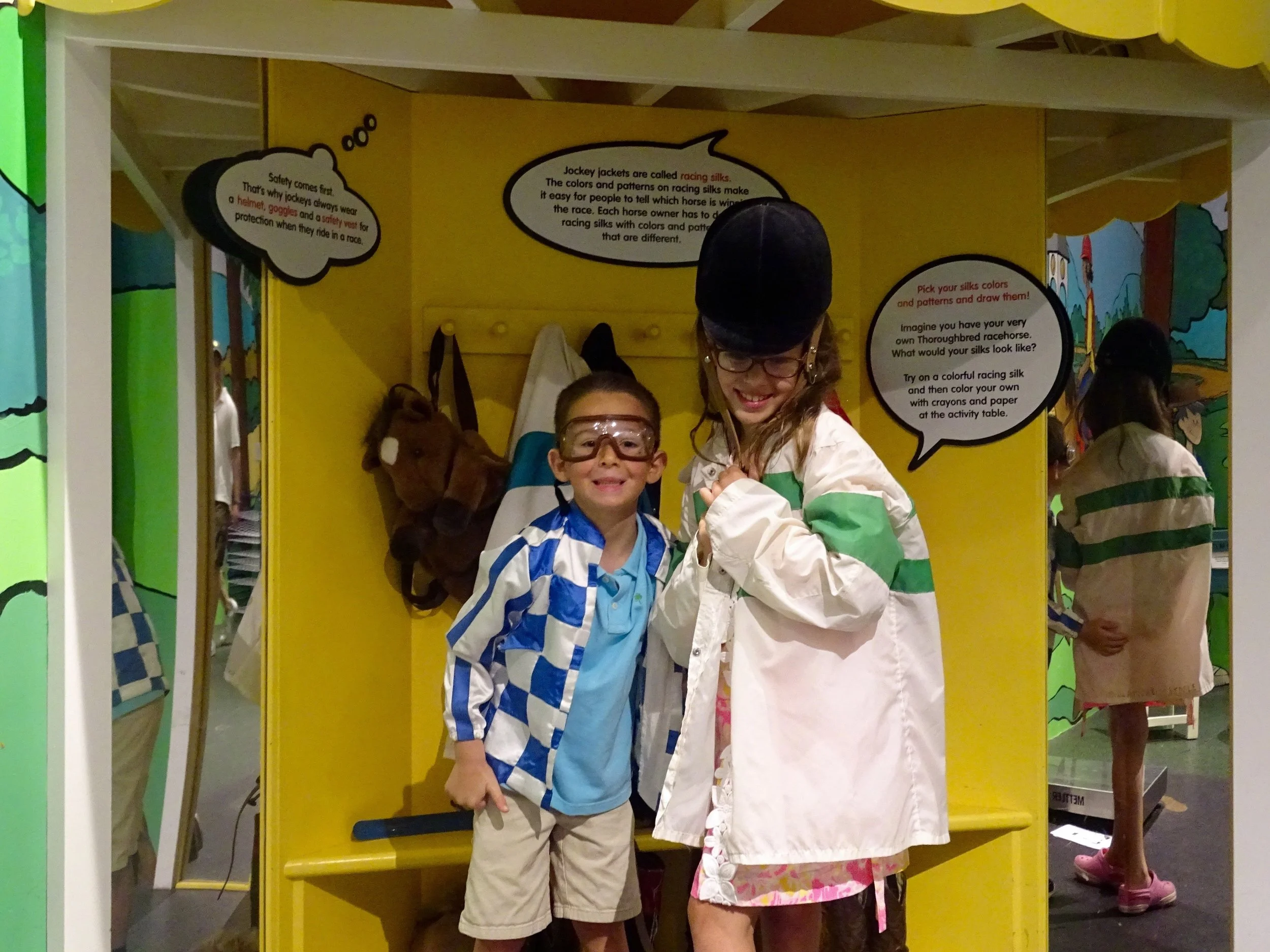 Playing dress up with jockey silks in "HorsePlay!"
