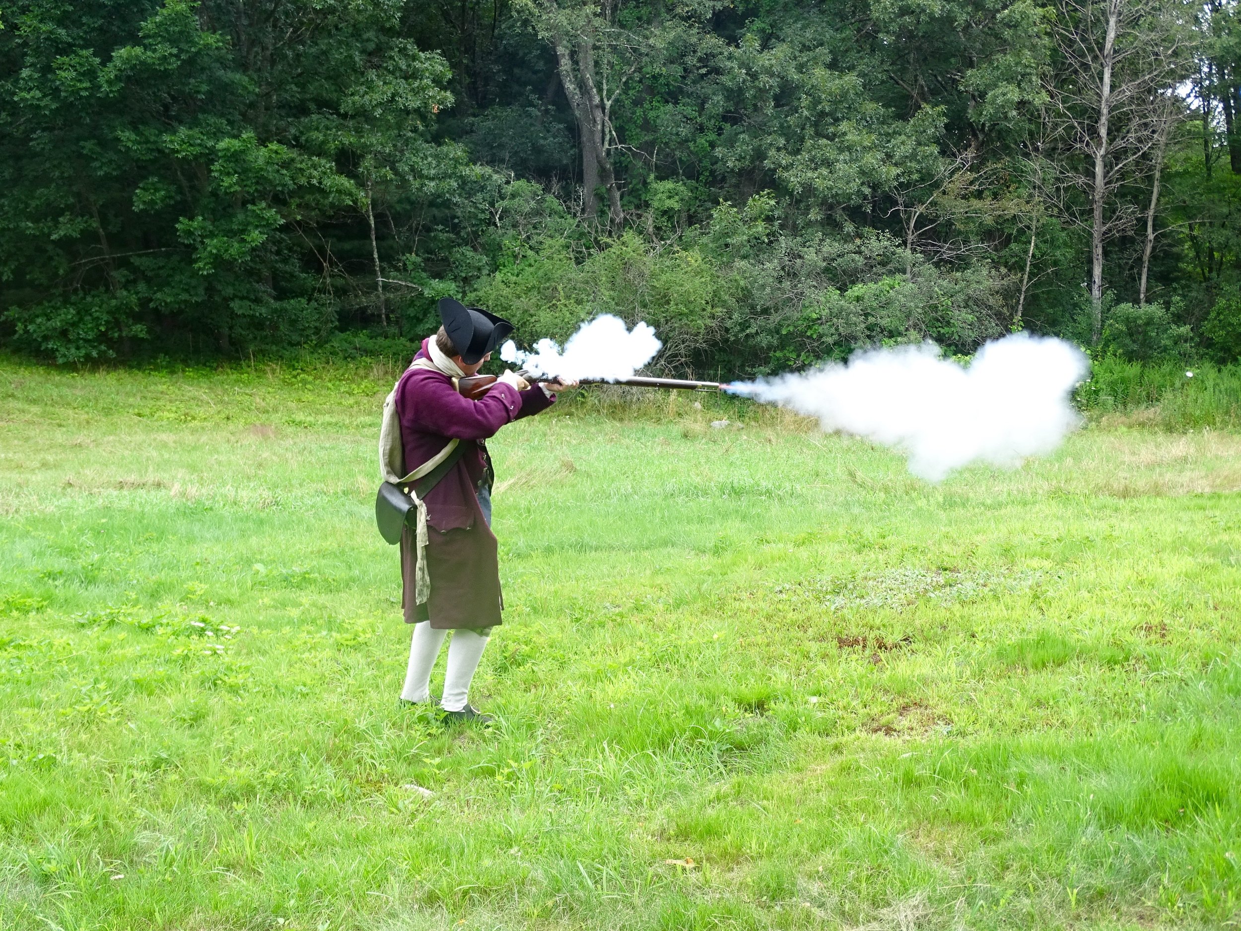 A musket firing demonstration on the Whittemore House property.