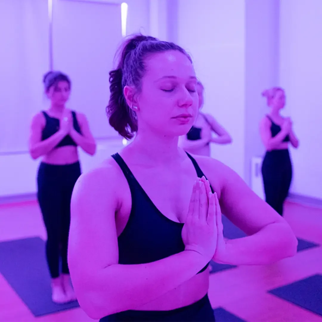 Yoga member poses during class at Midtown Yoga Durham