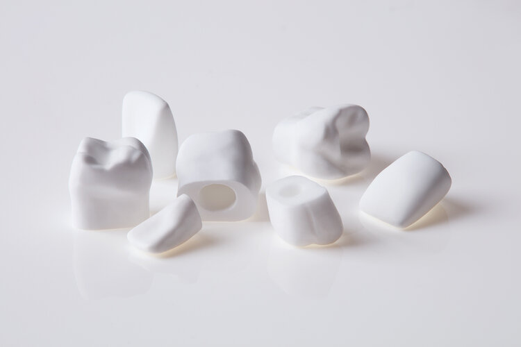 Cast hydroxyapatite teeth of various types with mounting holes to allow for placement in arrangements that mimic the human mouth. Himed casts numerous forms out of various calcium phosphate materials to aid researchers in both public and private sectors.