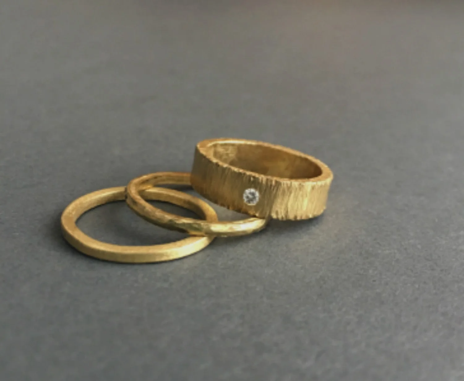 18K wide gold band with diamond and friends