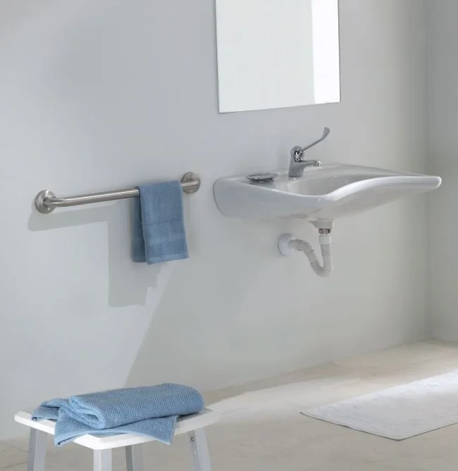 Stainless Steel Straight Grab Bar mounted next to bathroom sink.