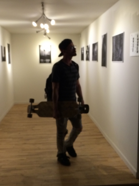  Skate boarder engaged with Wanderson's photos, Phoenix First Friday, 11-7-14 