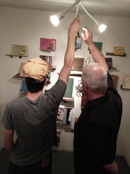  It takes two! Ben Peck and Ted Decker adjusting the lighting, 2-19-15  Photo credit: Alexis Duque 