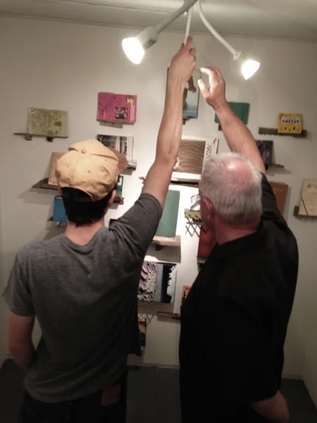 It takes two! Ben Peck and Ted Decker adjusting the lighting, 2-19-15 Photo credit: Alexis Duque