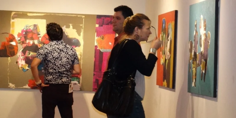  Art patrons enjoying Najelaa's paintings. Third Friday, 3-20-15. photo credit - Falah Alsaidi 