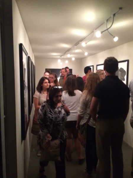  Art patrons enjoying Rigo's art works, First Friday, 4-3-15. Photo credit - Ted Decker 