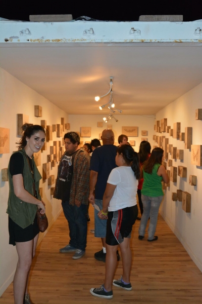  Art patrons viewing Lexie's exhibit, First Friday, 5-1-15. Photo credit - Salman Alwastey 