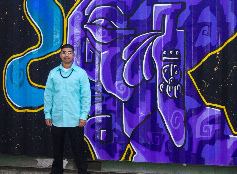    Edgar standing in front of the mural he painted, Third Friday, 10-16-15. Photo credit - Tania Ritko   