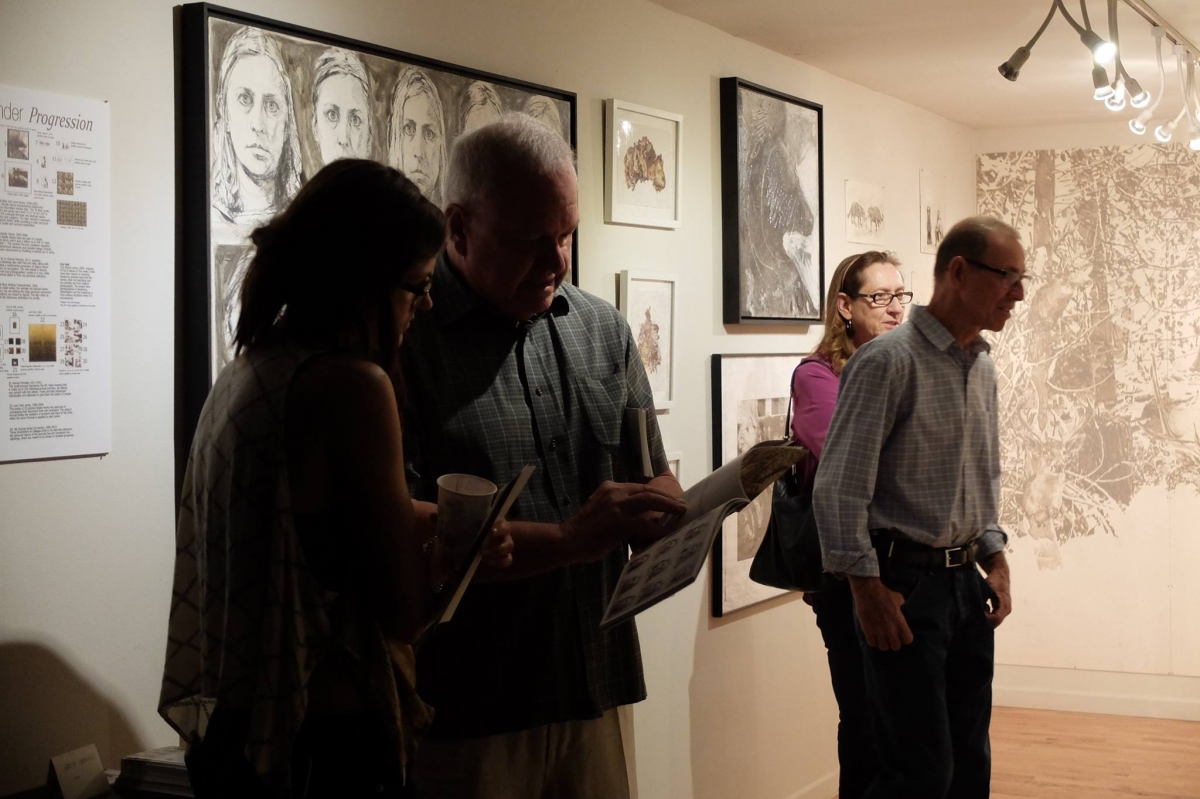  Viewers at Carolyn Lavender's exhibition, 3-18-16. Photo credit Salman Alwastey.  Photo credit: Ted Decker 