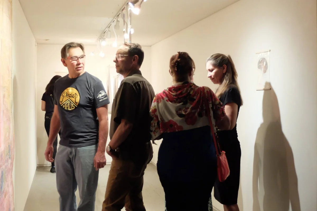 Viewers to Monica Aissa Martinez's exhibit, 3-18-16. Photo credit Salman Alwastey.Photo credit: Ted Decker