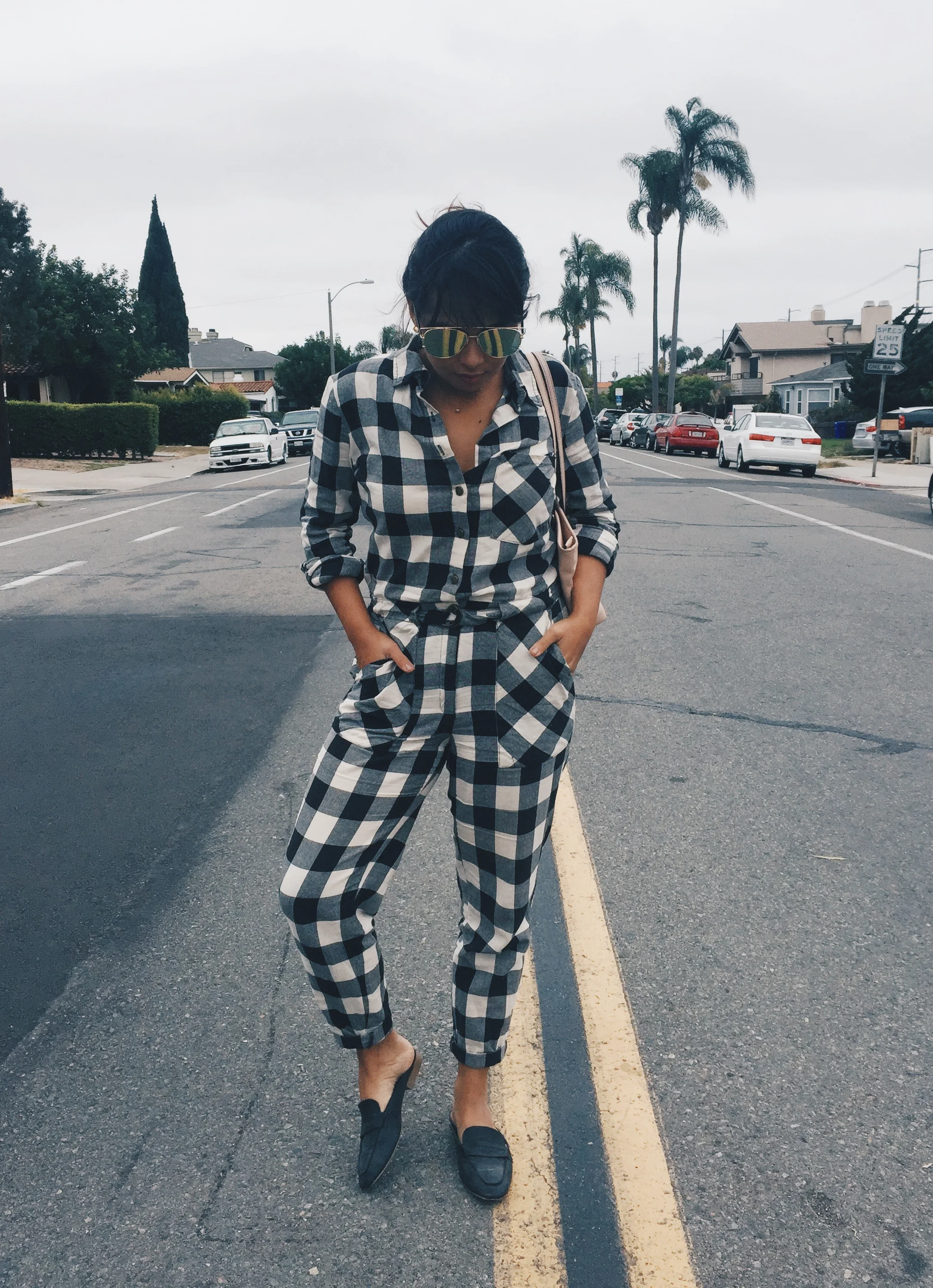 This jumpsuit is from Forever 21. I bought it over a year ago, but it's still available. Scroll down and you'll find it.