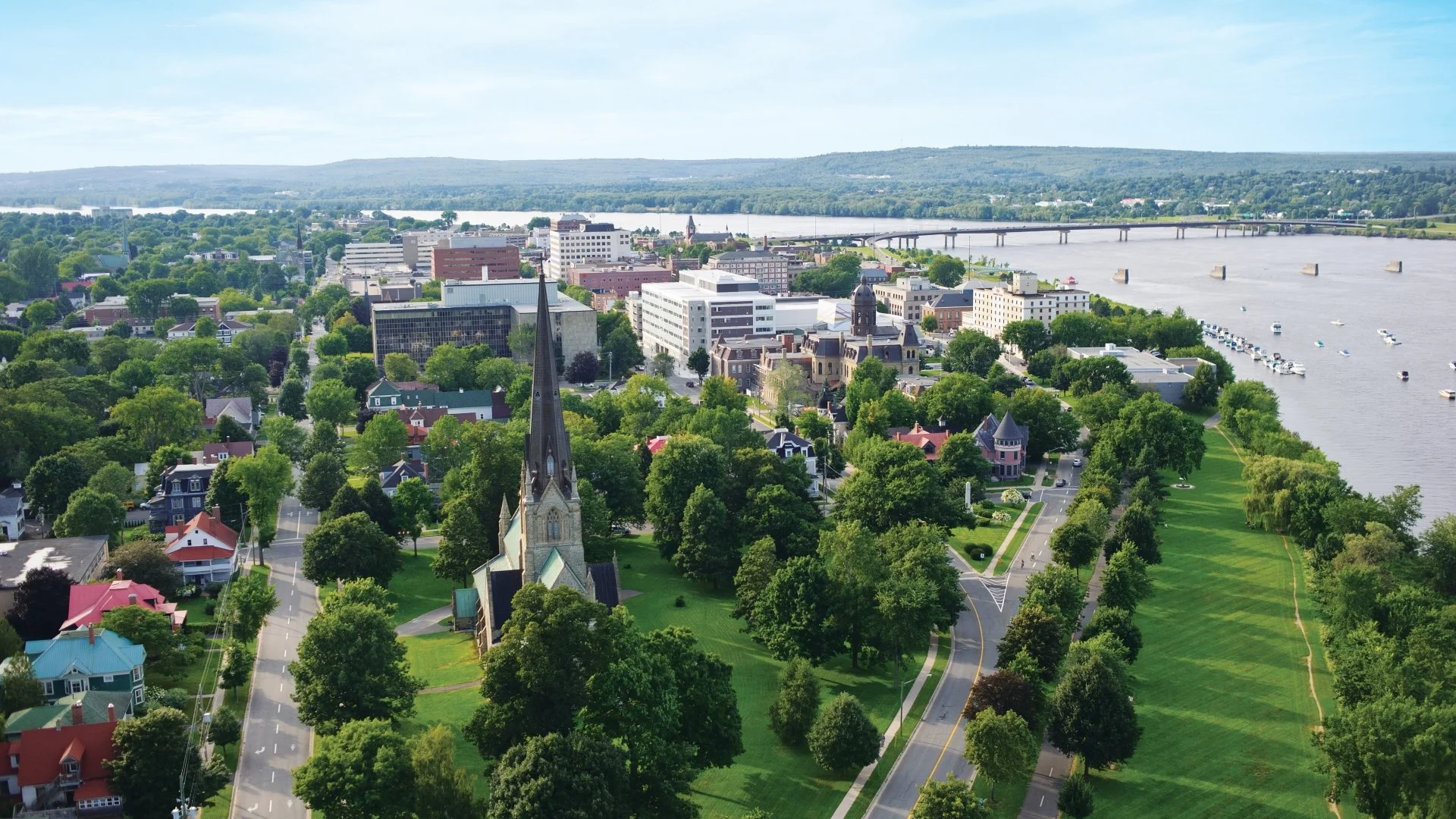 Downtown Fredericton aerial shot in fair weather, with bridge
