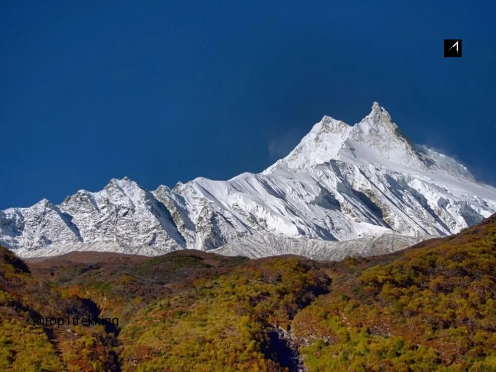 Double summit of Manaslu soaring above the sky