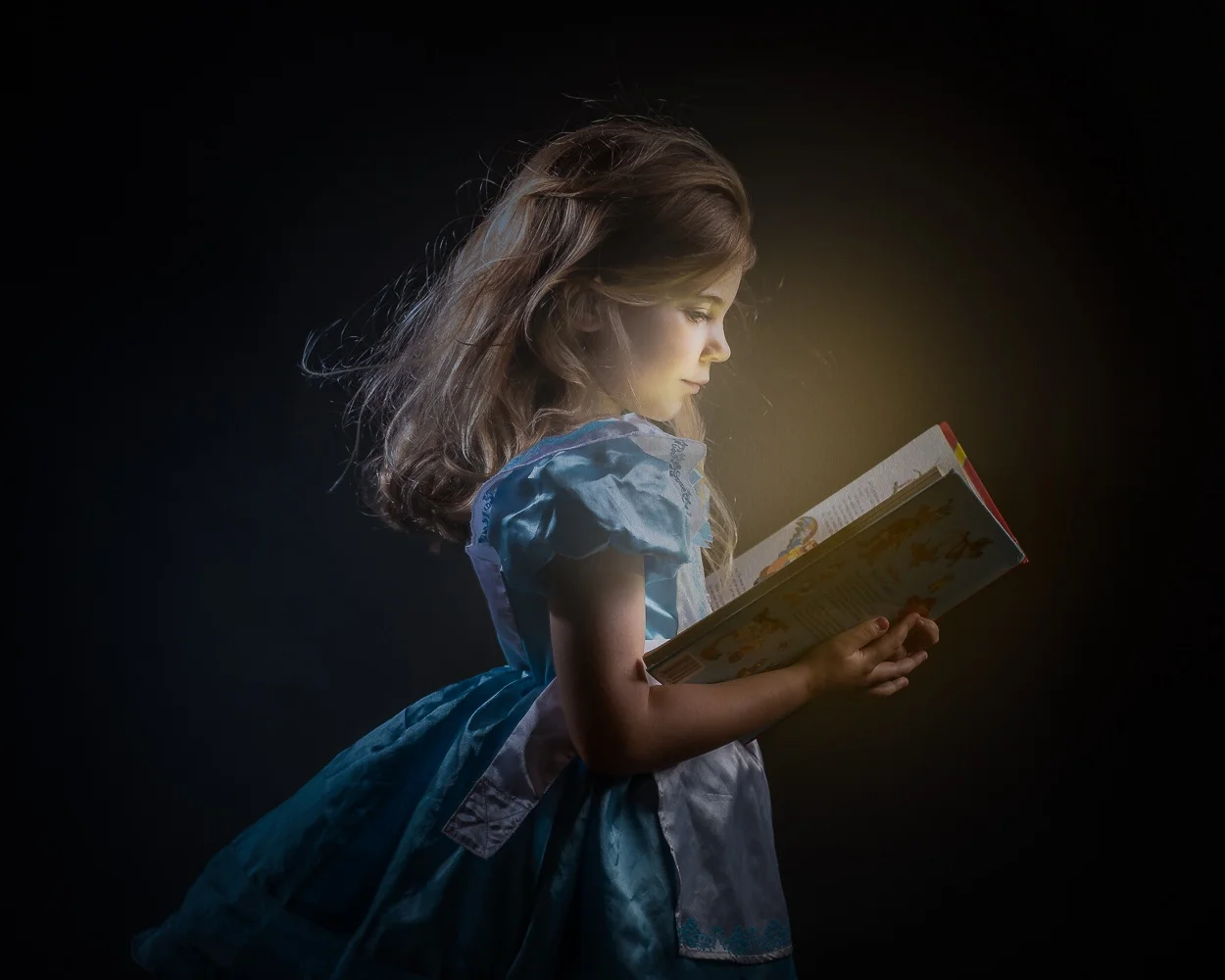 This is a portrait of my little girl, captured in April 2019. She is just at the age where she is learning to read and I wanted to capture the moment in her life when books were a way of entering a magical wonderland.
