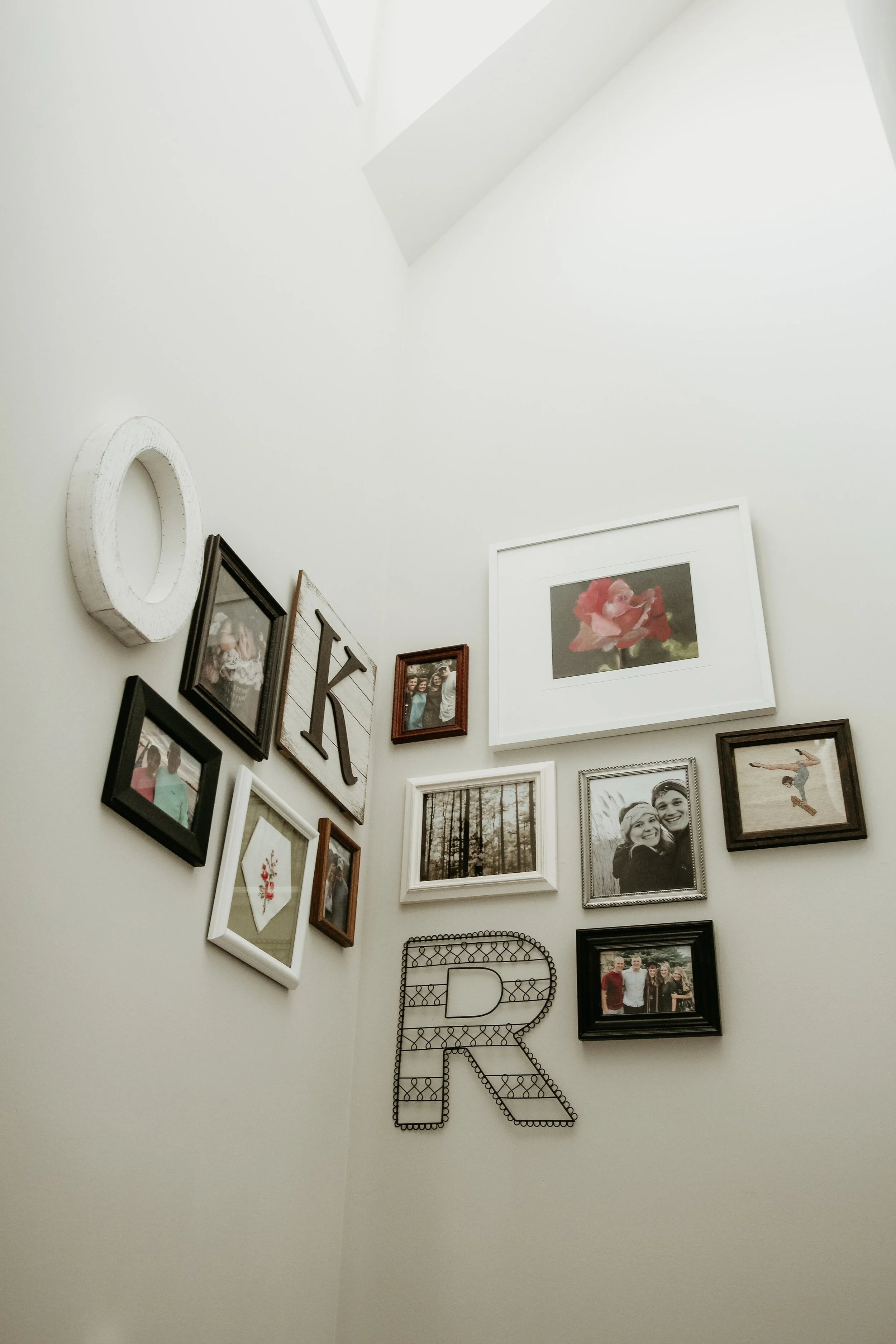 Breed healthy self-esteem and family identity in your kids by creating a photo wall at home.  Source:    Alex Durham    on   Unsplash   .