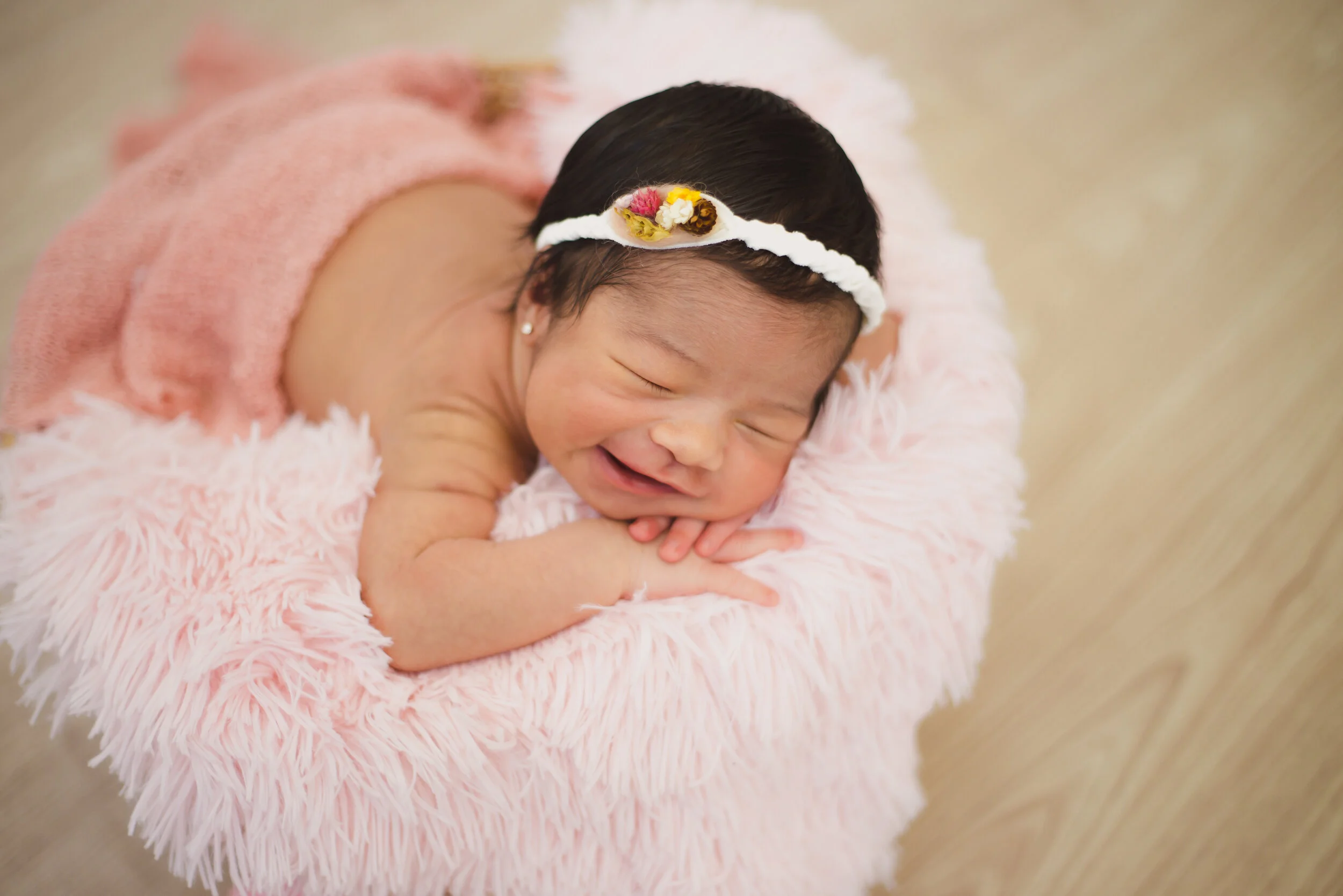 Mimicking normal sleeping poses or poses from the womb are most comfy for babies.  Source: Hélder Almeida on Unsplash.