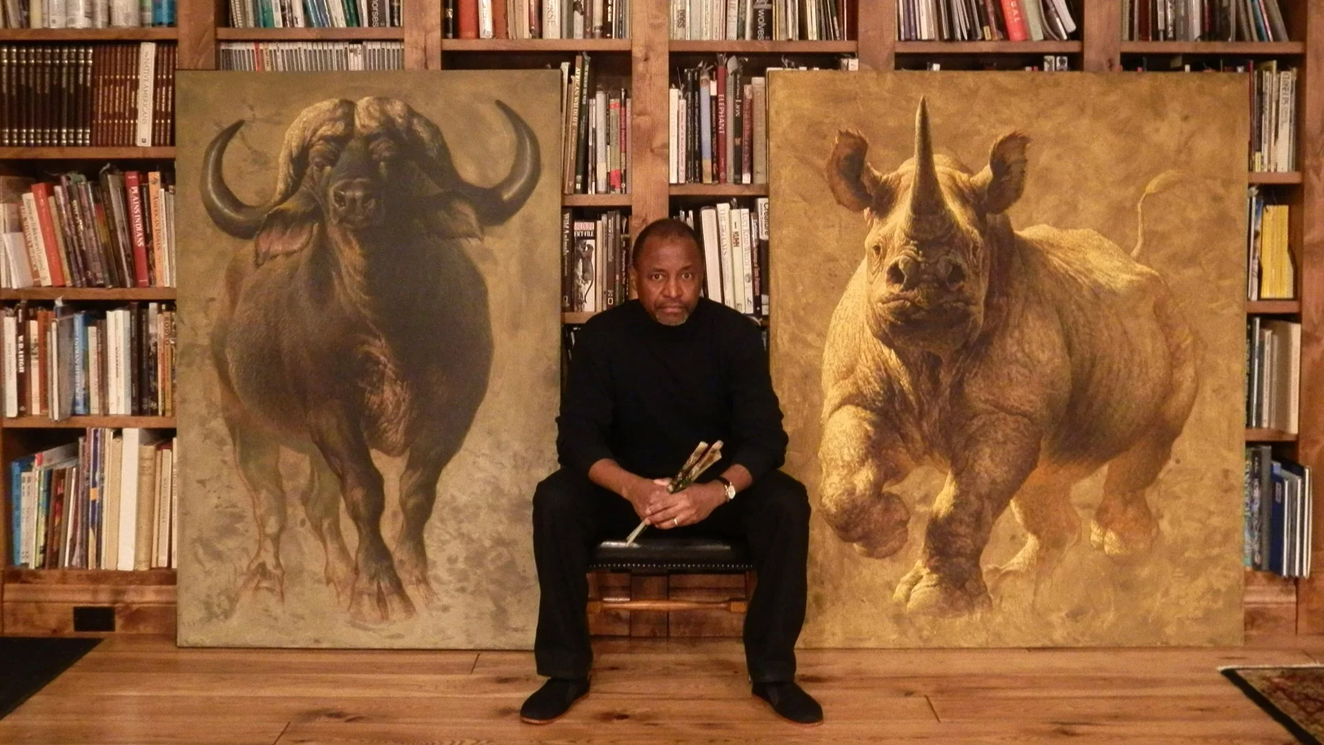 Ezra-Tucker-with-Paintings_web.jpg