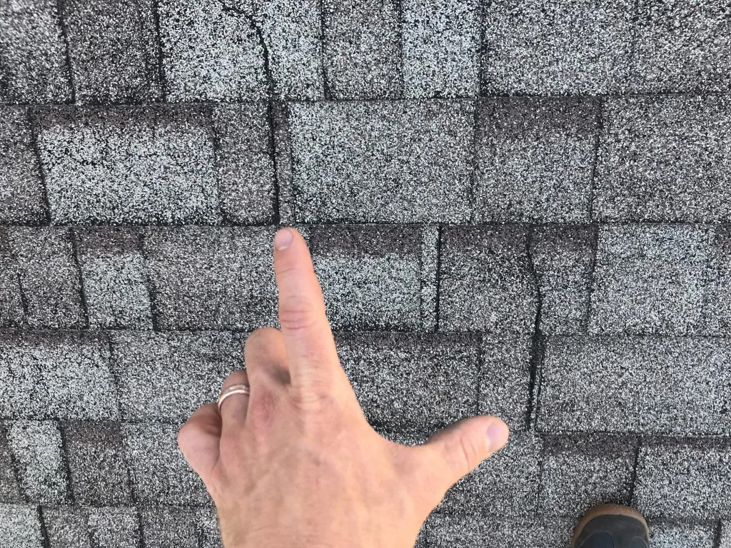 Cracked or missing shingles These expose the roofing membrane underneath the shingle. That membrane is designed to be covered with shingles and may become damaged and leak when exposed.
