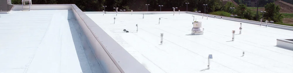 Above: This beautiful new white warehouse roof was restored with a Conklin roof coating.