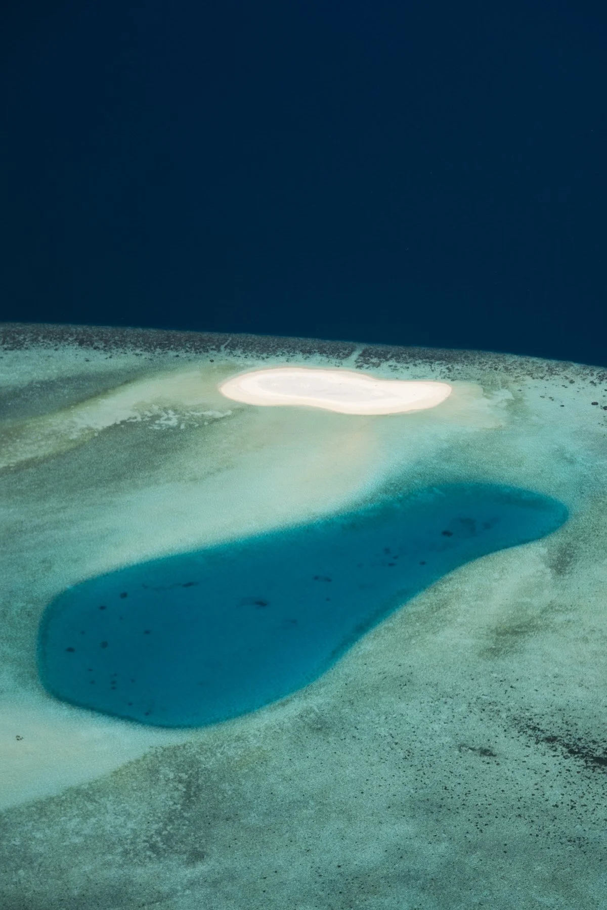 Blue waters of an island in the Maldives
