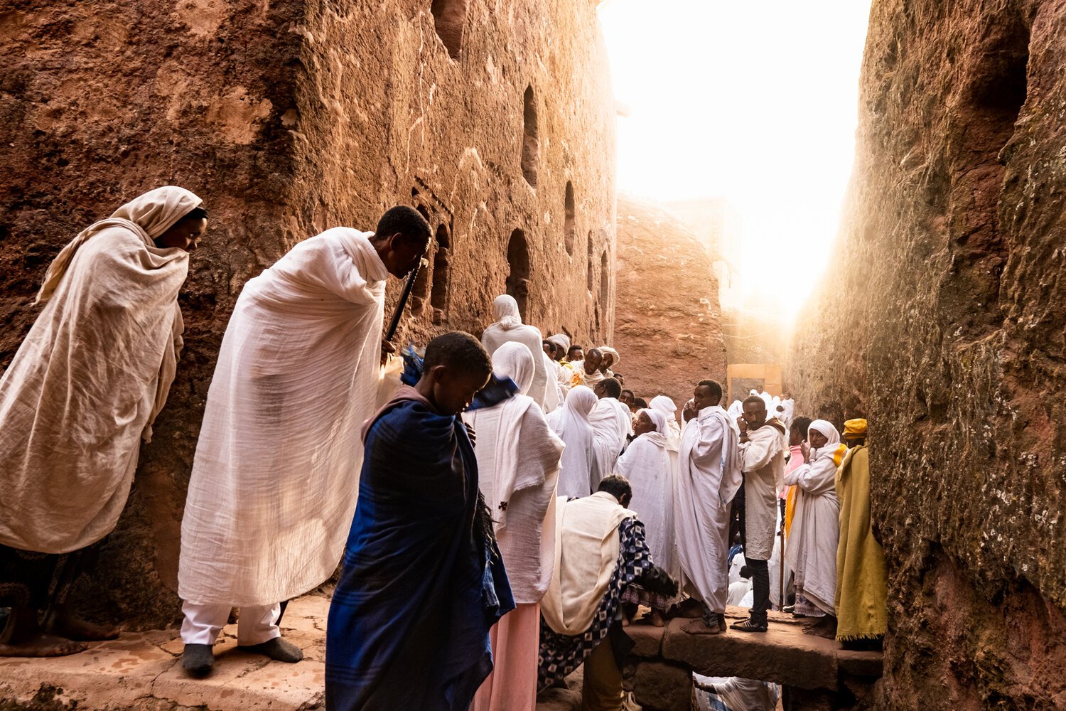 Pilgrims explore the rock hewn churches in Lalibela, Ethiopia