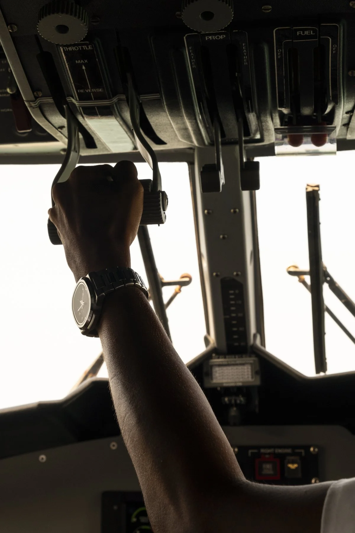 Pilot working controls of a seaplane in the cockpit