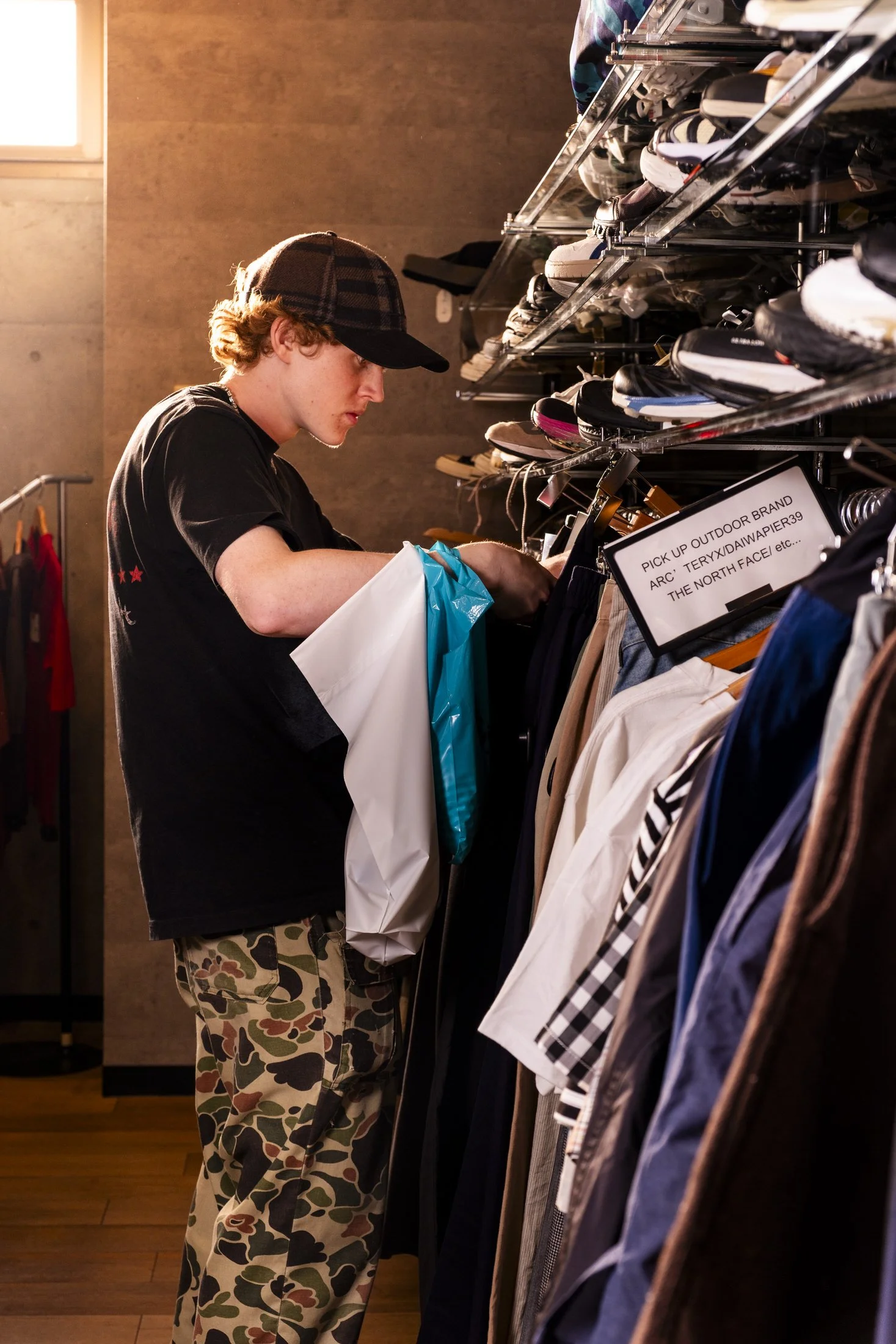 Shopper browsingvintage clothes at 2nd Street's Flagship store in Harajuku