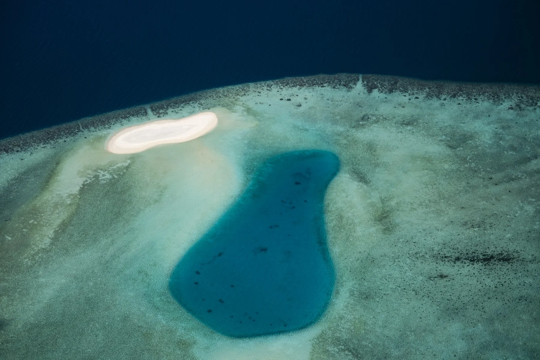 Blue waters of an island in the Maldives
