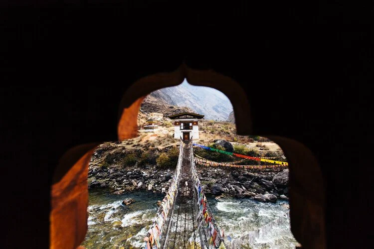Rope bridge over river in Bhutan