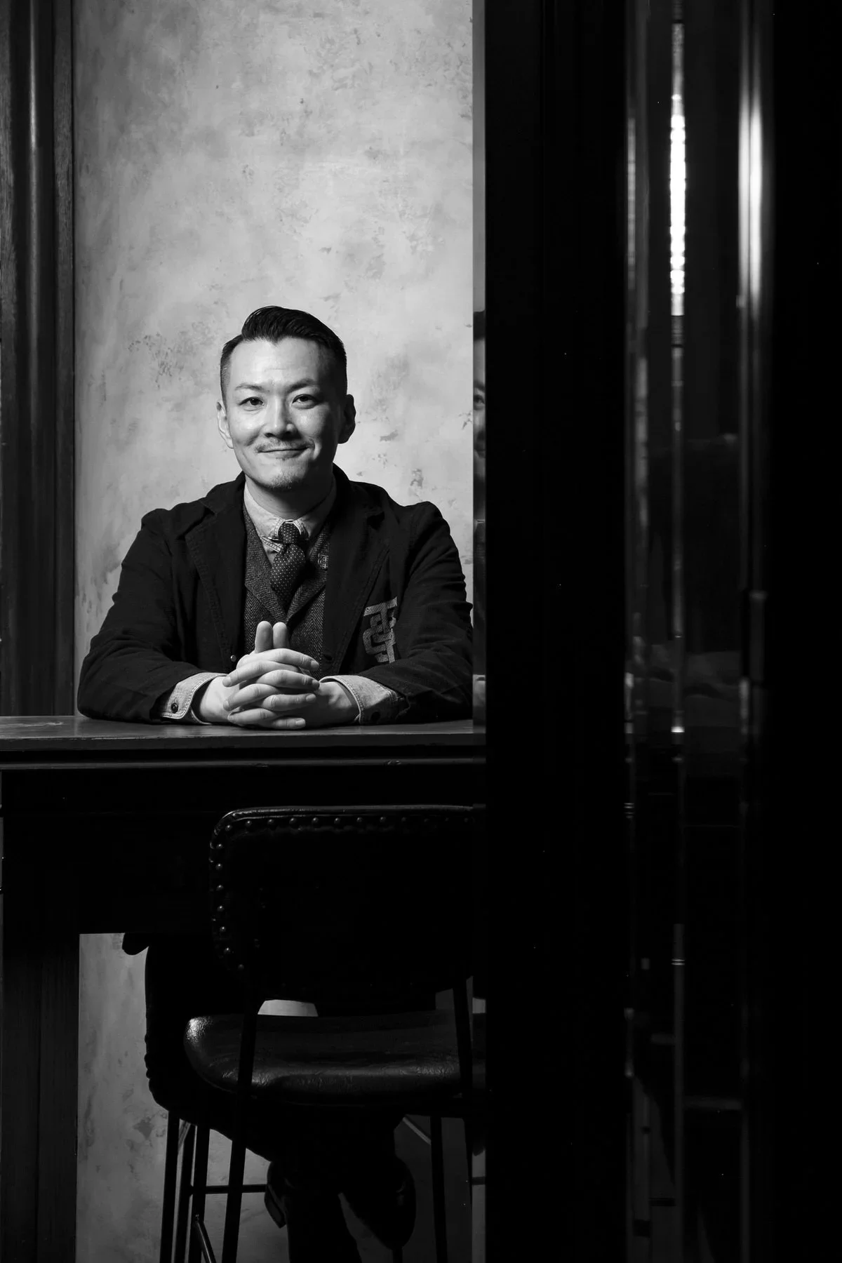 Shingo Gokan sits at his newly opened SG Tavern in Tokyo, Japan