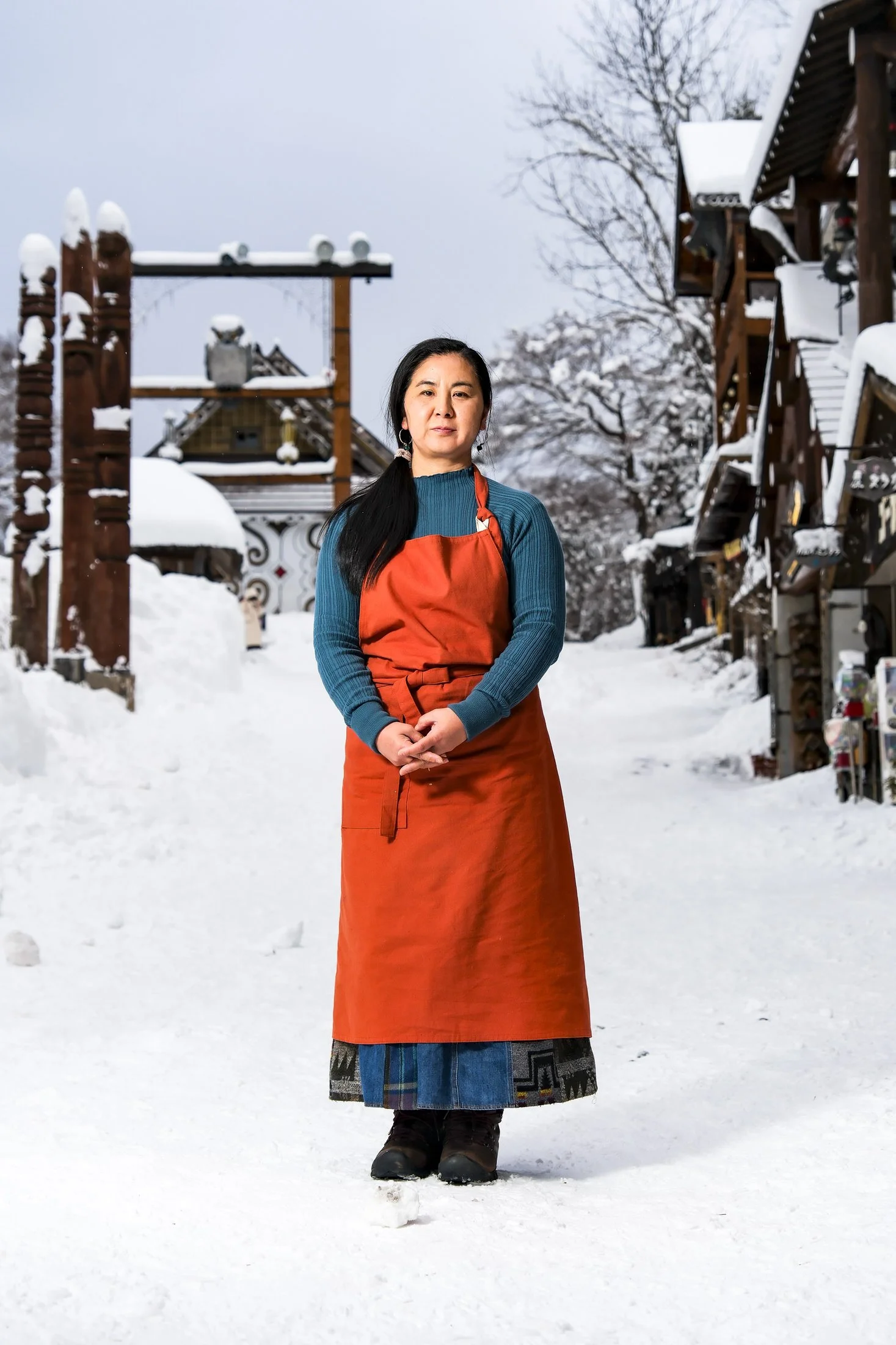 Ainu jewelry designer poses for a portrait in the Akan Ainu Village in Hokkaido, Japan