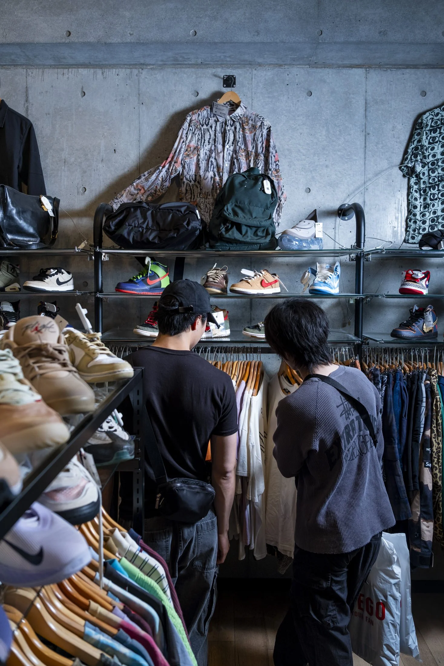 Shopper browsing shoes at 2nd Street's Flagship store in Harajuku