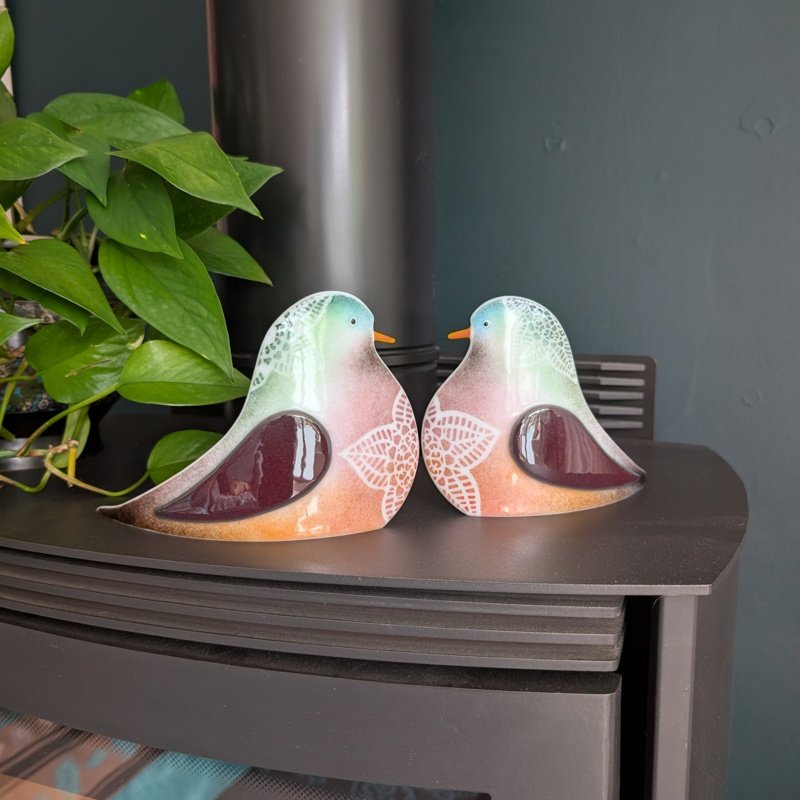 A pair of fused glass loved doves, slightly curved so they can be displayed in your home.