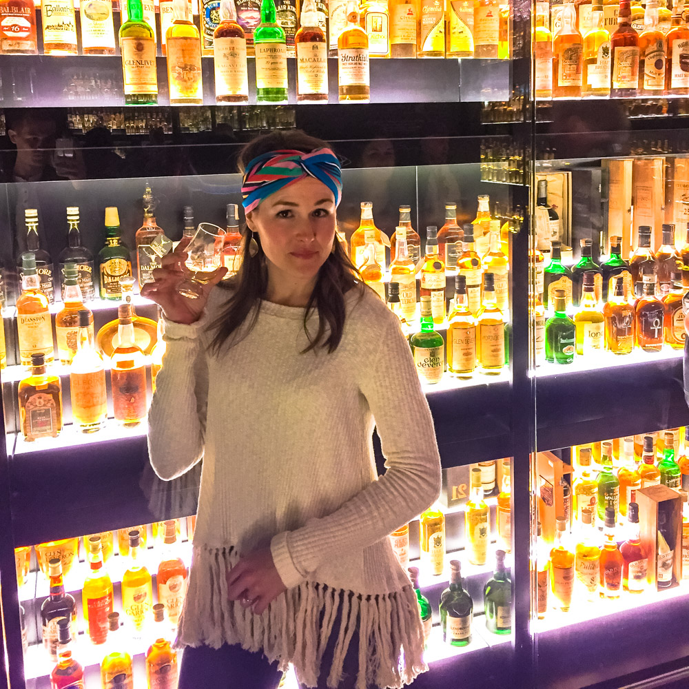 Enjoying Scotch sample in front of the world's largest collection of Scotch. 