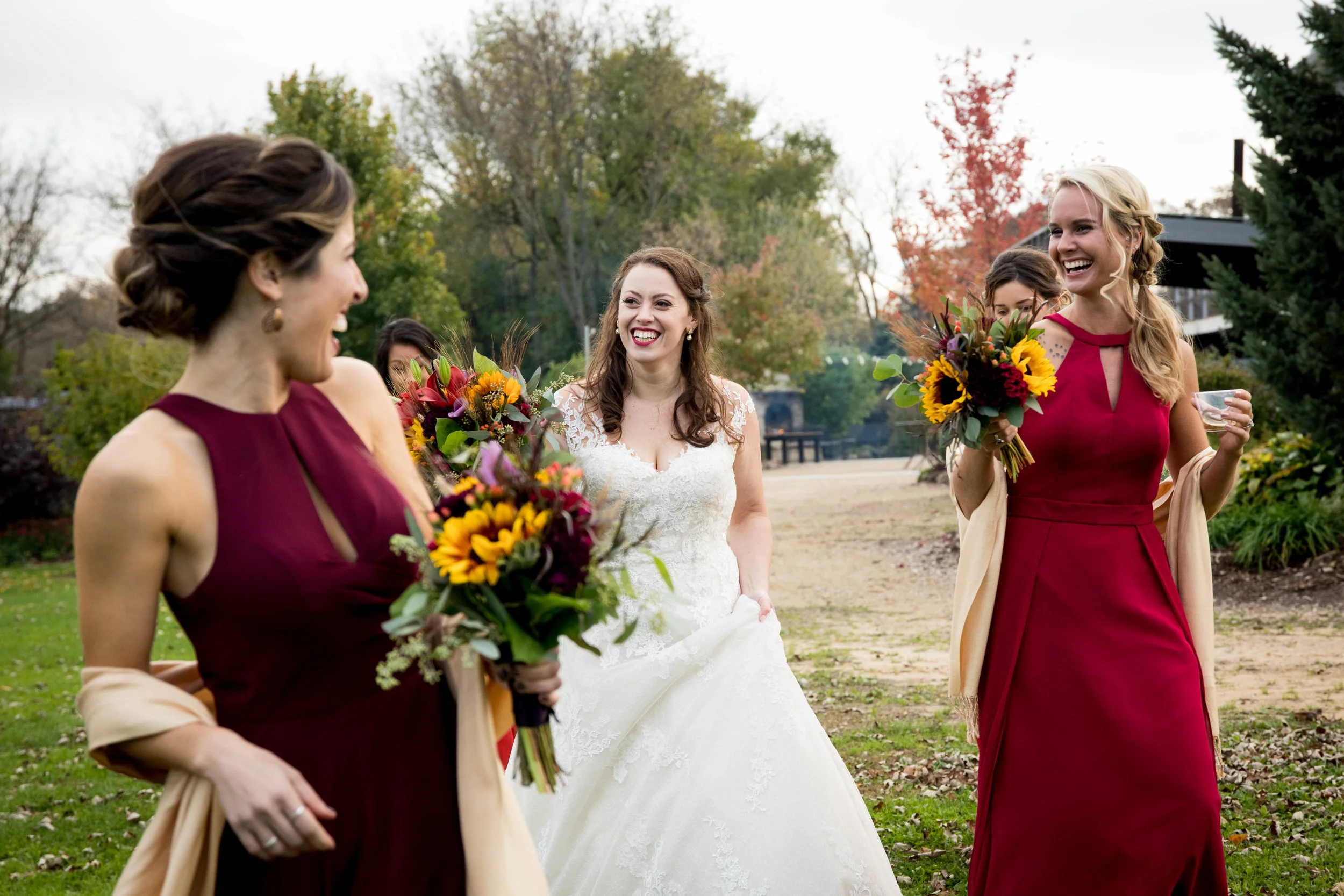 bride and bridesmaids at barn wedding