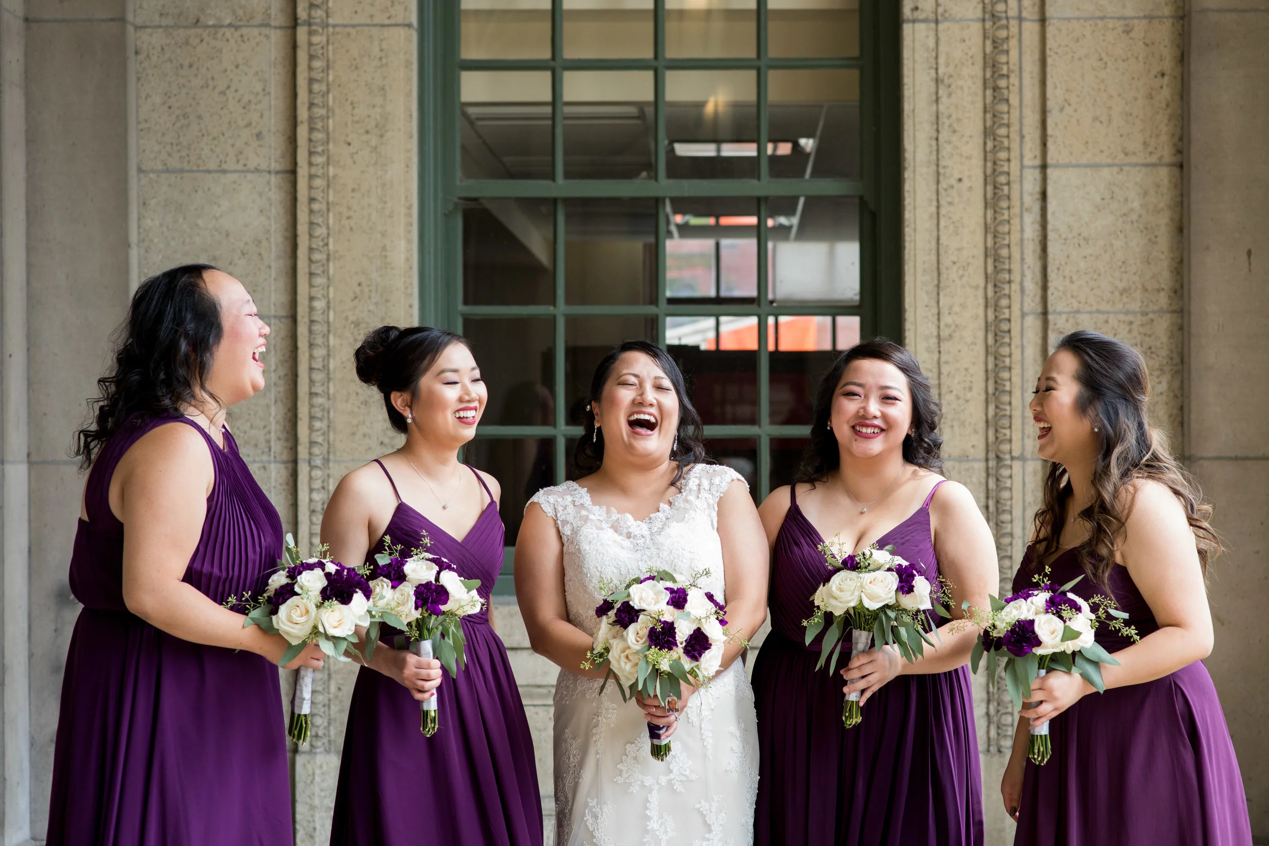 bride and bridesmaids laughing